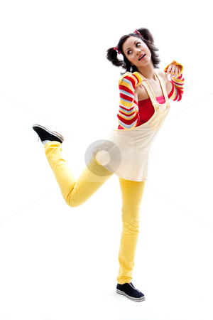 To use this stock image in your creative project, please select the size you need over to the right and click the "Add to Cart" button.
Your downloaded image will come with the Cutcaster watermark removed so don’t worry about the watermark you see on this page. Fun girl standing stock photo, Beautiful fun latina girl with bright colored arm warmers and ponytails with red ribbons in her hair standing with one leg up, isolated by Paul Hakimata