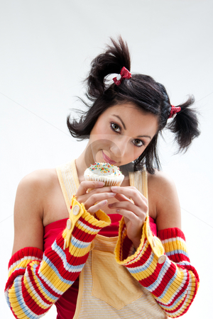 To use this stock image in your creative project, please select the size you need over to the right and click the "Add to Cart" button.
Your downloaded image will come with the Cutcaster watermark removed so don’t worry about the watermark you see on this page. Cupcake girl stock photo, Beautiful Latina girl with huge eyes open holding a cupcake, isolated by Paul Hakimata