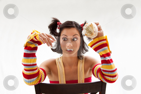 To use this stock image in your creative project, please select the size you need over to the right and click the "Add to Cart" button.
Your downloaded image will come with the Cutcaster watermark removed so don’t worry about the watermark you see on this page. Cupcake girl stock photo, Beautiful Latina girl eating a cupcake with her fingers looking cross eyed, isolated by Paul Hakimata