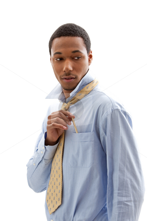 To use this stock image in your creative project, please select the size you need over to the right and click the "Add to Cart" button.
Your downloaded image will come with the Cutcaster watermark removed so don’t worry about the watermark you see on this page. Handsome man stock photo, Handsome African American male in blue shirt and yellow tie putting pen in pocket, isolated by Paul Hakimata