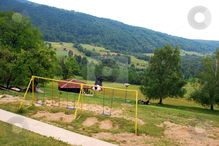 To use this stock image in your creative project, please select the size you need over to the right and click the "Add to Cart" button.
Your downloaded image will come with the Cutcaster watermark removed so don’t worry about the watermark you see on this page. Country-man on swing stock photo, Adult man swinging on swing over rural landscape by Julija Sapic