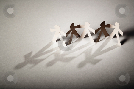 To use this stock image in your creative project, please select the size you need over to the right and click the "Add to Cart" button.
Your downloaded image will come with the Cutcaster watermark removed so don’t worry about the watermark you see on this page. Paper Dolls stock photo, Line of cutout paper dolls throwing a shadow by Scott Griessel