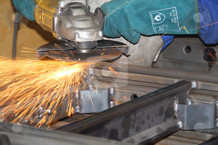 To use this stock image in your creative project, please select the size you need over to the right and click the "Add to Cart" button.
Your downloaded image will come with the Cutcaster watermark removed so don’t worry about the watermark you see on this page. Grinder throwing sparks off a steel structure stock photo, Grinder throwing sparks off a steel structure by Chris Alleaume