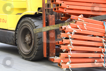 To use this stock image in your creative project, please select the size you need over to the right and click the "Add to Cart" button.
Your downloaded image will come with the Cutcaster watermark removed so don’t worry about the watermark you see on this page. Forklift carrying poles stock photo, Forklift carrying poles by Chris Alleaume