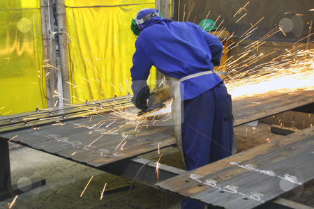 To use this stock image in your creative project, please select the size you need over to the right and click the "Add to Cart" button.
Your downloaded image will come with the Cutcaster watermark removed so don’t worry about the watermark you see on this page. Industrial worker grinder sheets of metal stock photo, Industrial worker grinder sheets of metal by Chris Alleaume
