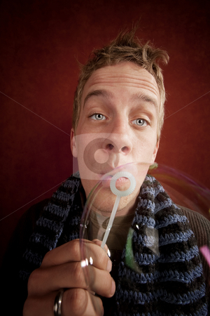 To use this stock image in your creative project, please select the size you need over to the right and click the "Add to Cart" button.
Your downloaded image will come with the Cutcaster watermark removed so don’t worry about the watermark you see on this page. Young Man Blowing a Bubble stock photo, Handsome young blonde man blowing a bubble by Scott Griessel
