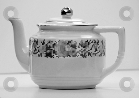 To use this stock image in your creative project, please select the size you need over to the right and click the "Add to Cart" button.
Your downloaded image will come with the Cutcaster watermark removed so don’t worry about the watermark you see on this page. Antique White Teapot with Floral Designs Black and White Photo stock photo, This white teapot with floral designs has been in my family several generations and is an antique. It has been a unique item and is set as a closeup in a black and white photo. by Valerie Garner