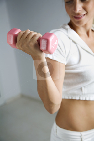 To use this stock image in your creative project, please select the size you need over to the right and click the "Add to Cart" button.
Your downloaded image will come with the Cutcaster watermark removed so don’t worry about the watermark you see on this page. Work out stock photo, Young fmale working out by Liv Friis-Larsen