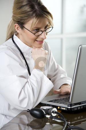 To use this stock image in your creative project, please select the size you need over to the right and click the "Add to Cart" button.
Your downloaded image will come with the Cutcaster watermark removed so don’t worry about the watermark you see on this page. Female doctor in her office stock photo, Doctor at her desk by Liv Friis-Larsen