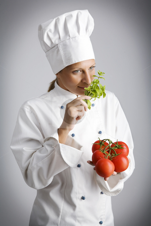 To use this stock image in your creative project, please select the size you need over to the right and click the "Add to Cart" button.
Your downloaded image will come with the Cutcaster watermark removed so don’t worry about the watermark you see on this page. Fresh ingredients stock photo, Female chef with fresh, natural ingredients by Liv Friis-Larsen