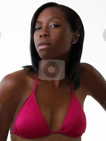 To use this stock image in your creative project, please select the size you need over to the right and click the "Add to Cart" button.
Your downloaded image will come with the Cutcaster watermark removed so don’t worry about the watermark you see on this page. Young black woman in red bikini top stock photo, Young african american woman in red swim suit top by Jeff Cleveland