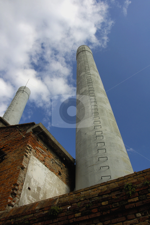 To use this stock image in your creative project, please select the size you need over to the right and click the "Add to Cart" button.
Your downloaded image will come with the Cutcaster watermark removed so don’t worry about the watermark you see on this page. Chimney stock photo, Two factory chimneys on the Venetian island of Murano, where glass is made. by Alistair Scott