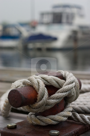 To use this stock image in your creative project, please select the size you need over to the right and click the "Add to Cart" button.
Your downloaded image will come with the Cutcaster watermark removed so don’t worry about the watermark you see on this page. Cleat closeup stock photo, A closeup of a cleat, with a rope tied around it. by Kevin Woodrow