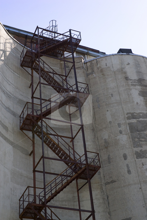 To use this stock image in your creative project, please select the size you need over to the right and click the "Add to Cart" button.
Your downloaded image will come with the Cutcaster watermark removed so don’t worry about the watermark you see on this page. Silo staircase stock photo, Staircase that extends up the side of a grain silo. by Kevin Woodrow