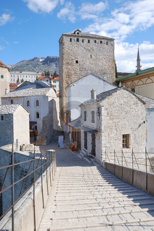 To use this stock image in your creative project, please select the size you need over to the right and click the "Add to Cart" button.
Your downloaded image will come with the Cutcaster watermark removed so don’t worry about the watermark you see on this page. Old Bridge East Tower in Mostar stock photo, View from the Old Bridge of the east tower in Mostar old town on a sunny day. by Denis Radovanovic