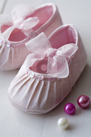 To use this stock image in your creative project, please select the size you need over to the right and click the "Add to Cart" button.
Your downloaded image will come with the Cutcaster watermark removed so don’t worry about the watermark you see on this page. Girls baby shoes stock photo, Closeup of pink satin baby shoes by Liv Friis-Larsen