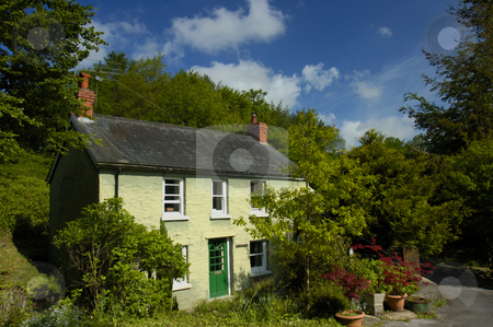 To use this stock image in your creative project, please select the size you need over to the right and click the "Add to Cart" button.
Your downloaded image will come with the Cutcaster watermark removed so don’t worry about the watermark you see on this page. Pen-y-Bont stock photo, A country cottage, in rural Wales, under a summer sky. by Alistair Scott