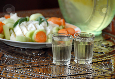 To use this stock image in your creative project, please select the size you need over to the right and click the "Add to Cart" button.
Your downloaded image will come with the Cutcaster watermark removed so don’t worry about the watermark you see on this page. Two drinks stock photo, Two small glasses with alcohol drink on wooden table by Julija Sapic