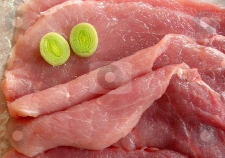 To use this stock image in your creative project, please select the size you need over to the right and click the "Add to Cart" button.
Your downloaded image will come with the Cutcaster watermark removed so don’t worry about the watermark you see on this page. Raw Meat stock photo, Raw pork meat face with leek green eyes by Julija Sapic