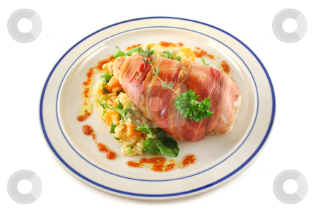 To use this stock image in your creative project, please select the size you need over to the right and click the "Add to Cart" button.
Your downloaded image will come with the Cutcaster watermark removed so don’t worry about the watermark you see on this page. Chicken Prosciutto stock photo, Chicken wrapped in prosciutto on pumpkin and rocket risotto. by Brett Mulcahy
