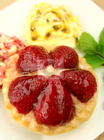 To use this stock image in your creative project, please select the size you need over to the right and click the "Add to Cart" button.
Your downloaded image will come with the Cutcaster watermark removed so don’t worry about the watermark you see on this page. Strawberry Custard Tart stock photo, Strawberry custard tart with passionfruit cream and cranberry cream with a mint garnish. by Brett Mulcahy