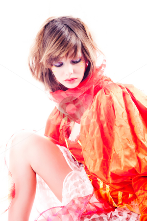 To use this stock image in your creative project, please select the size you need over to the right and click the "Add to Cart" button.
Your downloaded image will come with the Cutcaster watermark removed so don’t worry about the watermark you see on this page. Cute teenage girl in an orange fancy dress thinking stock photo, Studio portrait of a girl in a special stylised dress by Frenk and Danielle Kaufmann