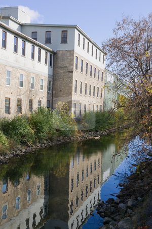 To use this stock image in your creative project, please select the size you need over to the right and click the "Add to Cart" button.
Your downloaded image will come with the Cutcaster watermark removed so don’t worry about the watermark you see on this page. Factory reflection along the river stock photo, An old factory building, lining a small river, with its reflection visible in the still water. by Kevin Woodrow