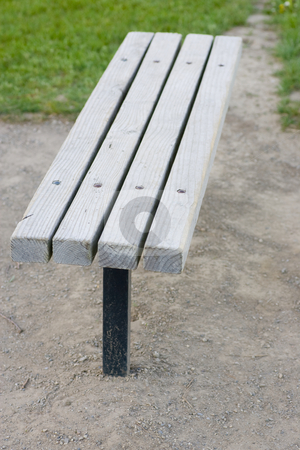 To use this stock image in your creative project, please select the size you need over to the right and click the "Add to Cart" button.
Your downloaded image will come with the Cutcaster watermark removed so don’t worry about the watermark you see on this page. Lonely bench stock photo, A wooden bench surrounded by gravel, with some grass in the background. by Kevin Woodrow
