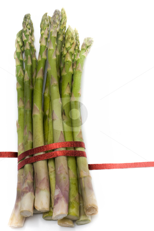 To use this stock image in your creative project, please select the size you need over to the right and click the "Add to Cart" button.
Your downloaded image will come with the Cutcaster watermark removed so don’t worry about the watermark you see on this page. Asparagus with ribbon stock photo, A bunch of asparagus, tied with red ribbon, isolated on white. by Kevin Woodrow