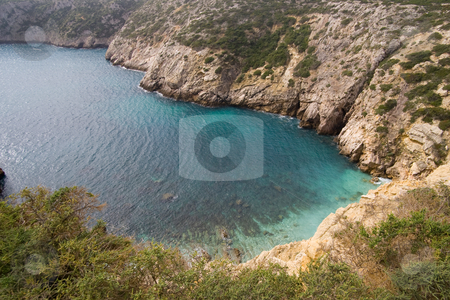 To use this stock image in your creative project, please select the size you need over to the right and click the "Add to Cart" button.
Your downloaded image will come with the Cutcaster watermark removed so don’t worry about the watermark you see on this page. Small Bay in Portugal stock photo, A small bay in the Algarve with clear emerald water, on the way to Cape Saint Vincent, Sagres, Portugal. by Kevin Woodrow