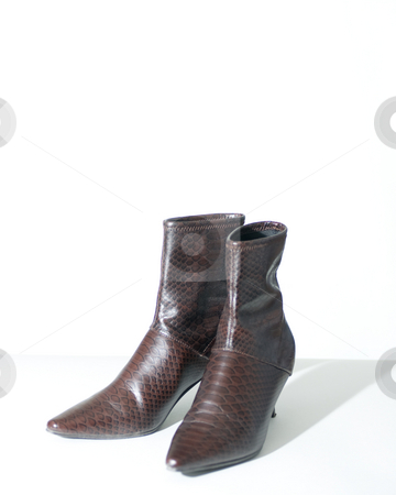 To use this stock image in your creative project, please select the size you need over to the right and click the "Add to Cart" button.
Your downloaded image will come with the Cutcaster watermark removed so don’t worry about the watermark you see on this page. Womans boots, isolated on white stock photo, Womans ankle high boots, isolated on white background. by Kevin Woodrow