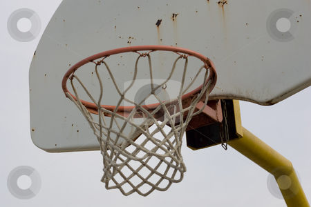 To use this stock image in your creative project, please select the size you need over to the right and click the "Add to Cart" button.
Your downloaded image will come with the Cutcaster watermark removed so don’t worry about the watermark you see on this page. Basketball net and backboard, closeup stock photo, A closeup view of an old baketball net and backboard, isolated against a blue sky. by Kevin Woodrow