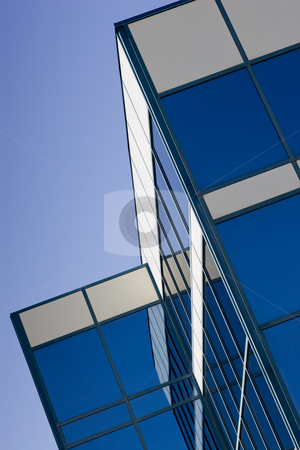To use this stock image in your creative project, please select the size you need over to the right and click the "Add to Cart" button.
Your downloaded image will come with the Cutcaster watermark removed so don’t worry about the watermark you see on this page. Glass office building stock photo, Glass Office Building and reflection, with a blue sky background. by Kevin Woodrow