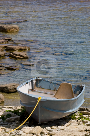 To use this stock image in your creative project, please select the size you need over to the right and click the "Add to Cart" button.
Your downloaded image will come with the Cutcaster watermark removed so don’t worry about the watermark you see on this page. Washed up on shore stock photo, An old boat, tied up on the rocks, at the waters edge. by Kevin Woodrow