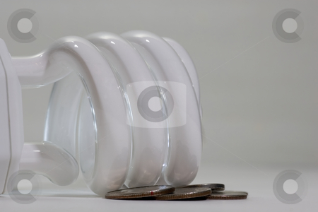 To use this stock image in your creative project, please select the size you need over to the right and click the "Add to Cart" button.
Your downloaded image will come with the Cutcaster watermark removed so don’t worry about the watermark you see on this page. Saving money with new lighting stock photo, A compact fluorescent bulb, lying on its side with some american quarters, dimes and nickels scattered around it. by Kevin Woodrow