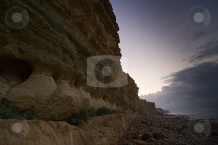 To use this stock image in your creative project, please select the size you need over to the right and click the "Add to Cart" button.
Your downloaded image will come with the Cutcaster watermark removed so don’t worry about the watermark you see on this page. Early morning cliff walls stock photo, Cliff detail fading into an early morning sky, along the beaches in Lagos, Portugal. by Kevin Woodrow