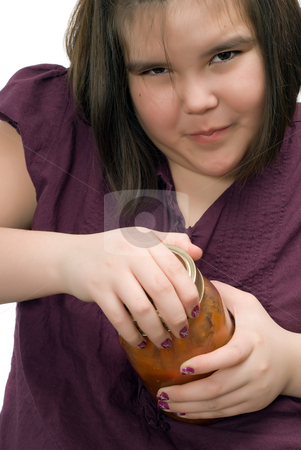To use this stock image in your creative project, please select the size you need over to the right and click the "Add to Cart" button.
Your downloaded image will come with the Cutcaster watermark removed so don’t worry about the watermark you see on this page. Persistence Concept stock photo, Closeup of a young girl being persistent and trying to open a glass jar of tomato salsa by Richard Nelson