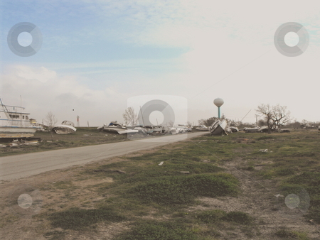 To use this stock image in your creative project, please select the size you need over to the right and click the "Add to Cart" button.
Your downloaded image will come with the Cutcaster watermark removed so don’t worry about the watermark you see on this page. Hurricane Ike stock photo, Boats along a road after Hurricane Ike flooded a marina at Pleasure Island,Port Arthur Texas by Robert Brown