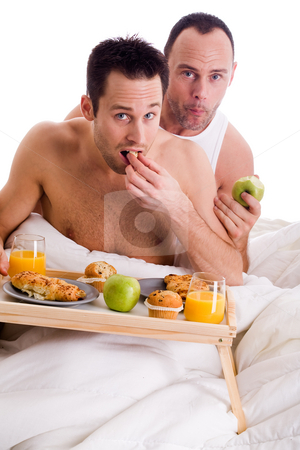 To use this stock image in your creative project, please select the size you need over to the right and click the "Add to Cart" button.
Your downloaded image will come with the Cutcaster watermark removed so don’t worry about the watermark you see on this page. Home couple eating healthy stock photo, A Happy homo couple and their breakfast on a tray in bed by Frenk and Danielle Kaufmann