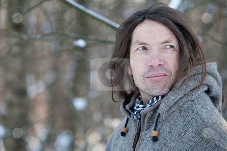 To use this stock image in your creative project, please select the size you need over to the right and click the "Add to Cart" button.
Your downloaded image will come with the Cutcaster watermark removed so don’t worry about the watermark you see on this page. Character face in winter scape stock photo, Man with characteristic face standing in a winter landscape by Frenk and Danielle Kaufmann