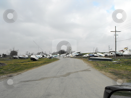 To use this stock image in your creative project, please select the size you need over to the right and click the "Add to Cart" button.
Your downloaded image will come with the Cutcaster watermark removed so don’t worry about the watermark you see on this page. Wrecked boats stock photo, Deystroyed boats left after hurricane Ike hit Pleasurt Island,Port Arthur, Tecas by Robert Brown