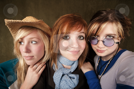 To use this stock image in your creative project, please select the size you need over to the right and click the "Add to Cart" button.
Your downloaded image will come with the Cutcaster watermark removed so don’t worry about the watermark you see on this page. Three Young Girls stock photo, Portrait of three pretty young girls on a green background by Scott Griessel