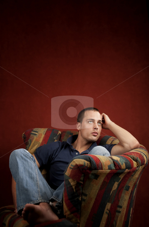 To use this stock image in your creative project, please select the size you need over to the right and click the "Add to Cart" button.
Your downloaded image will come with the Cutcaster watermark removed so don’t worry about the watermark you see on this page. Handsome young man stock photo, Handsome young man reclining in a colorful chair by Scott Griessel