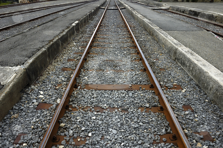 To use this stock image in your creative project, please select the size you need over to the right and click the "Add to Cart" button.
Your downloaded image will come with the Cutcaster watermark removed so don’t worry about the watermark you see on this page. The empty station stock photo, A grungy empty station platform with the rusting railway lines stretching away into the distance. by Alistair Scott