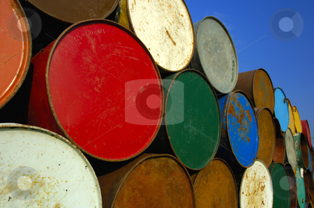 To use this stock image in your creative project, please select the size you need over to the right and click the "Add to Cart" button.
Your downloaded image will come with the Cutcaster watermark removed so don’t worry about the watermark you see on this page. Oil barrels stock photo, A stack of multi-coloured oil barrels, towering in to the clear blue sky. Space for text in the sky. by Alistair Scott