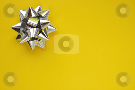 To use this stock image in your creative project, please select the size you need over to the right and click the "Add to Cart" button.
Your downloaded image will come with the Cutcaster watermark removed so don’t worry about the watermark you see on this page. Star on yellow stock photo, A decorative star, made from silver ribbon, on a plain yellow background with space for text (copy). by Alistair Scott