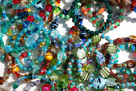 To use this stock image in your creative project, please select the size you need over to the right and click the "Add to Cart" button.
Your downloaded image will come with the Cutcaster watermark removed so don’t worry about the watermark you see on this page. Colorful Jewelry stock photo, Coroful necklaces and bracelets with sunlight over white background. by Denis Radovanovic