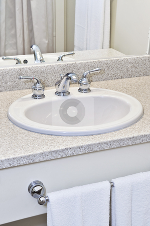 To use this stock image in your creative project, please select the size you need over to the right and click the "Add to Cart" button.
Your downloaded image will come with the Cutcaster watermark removed so don’t worry about the watermark you see on this page. Bathroom sink stock photo, Bathroom interior with white sink, faucet and mirror by Elena Elisseeva