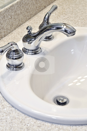 To use this stock image in your creative project, please select the size you need over to the right and click the "Add to Cart" button.
Your downloaded image will come with the Cutcaster watermark removed so don’t worry about the watermark you see on this page. Bathroom sink stock photo, Bathroom interior with white sink and faucet by Elena Elisseeva