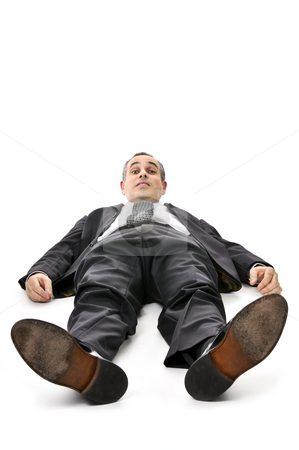To use this stock image in your creative project, please select the size you need over to the right and click the "Add to Cart" button.
Your downloaded image will come with the Cutcaster watermark removed so don’t worry about the watermark you see on this page. Businessman laying down on white background stock photo, Scared businessman laying down in a suit isolated on white background by Elena Elisseeva